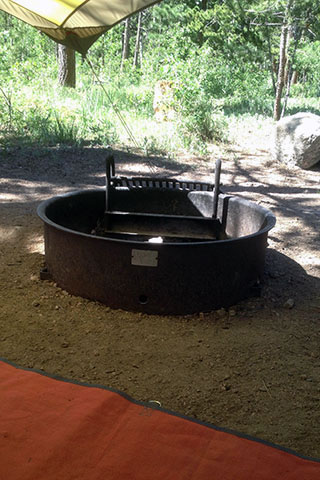 dormant fire pit in the campground