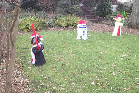 figures of Yoda, R2D2, and Darth Vader in a neighbors yard
