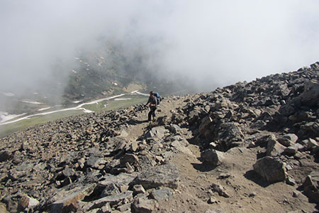 Climbing the steep trail through the clouds