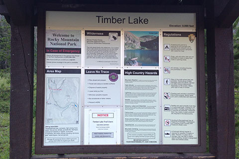 An informative trailhead kiosk for the Timber Lake Trail in Rocky Mountain National Park.